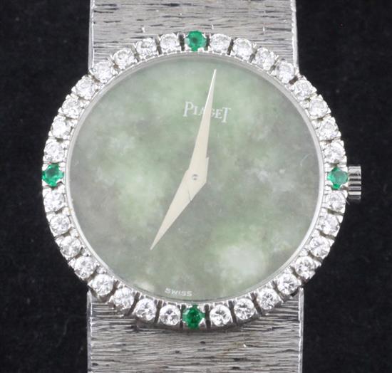 A ladys 18ct white gold Piaget manual wind wrist watch with diamond and emerald set bezel and jade dial,